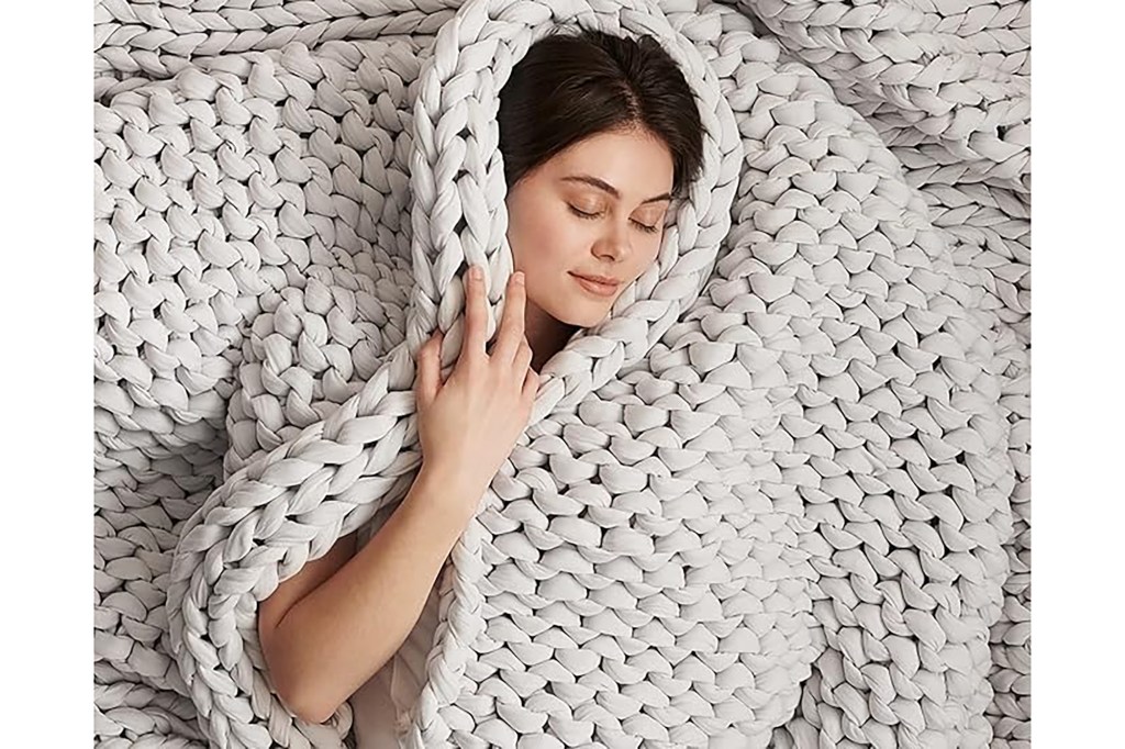 A woman lying on a blanket